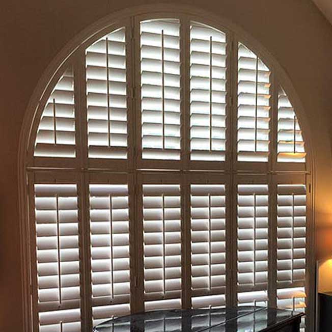 arched window with shutters