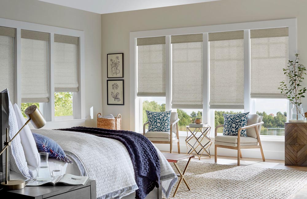 woven wood blinds in the master bedroom